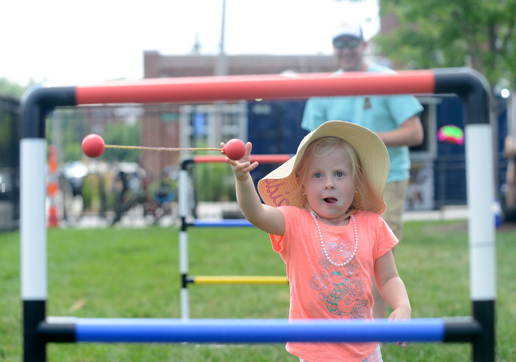 Vivian Refit and her uncle Travis McCartney play a game of ladder toss